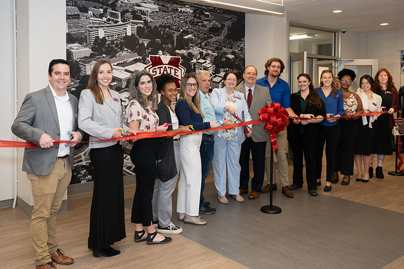 Faculty, staff and students celebrate the opening of the new location