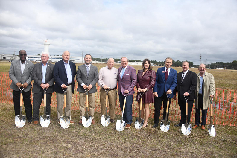 Officials with shovels at groundbreaking ceremony