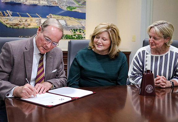 Mark E. Keenum, Susan Jacobs and Kari Wilkinson