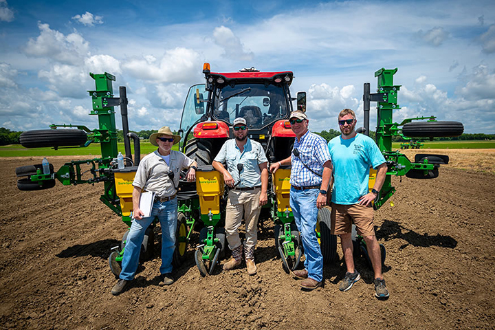 Personnel pictured with planting equipment