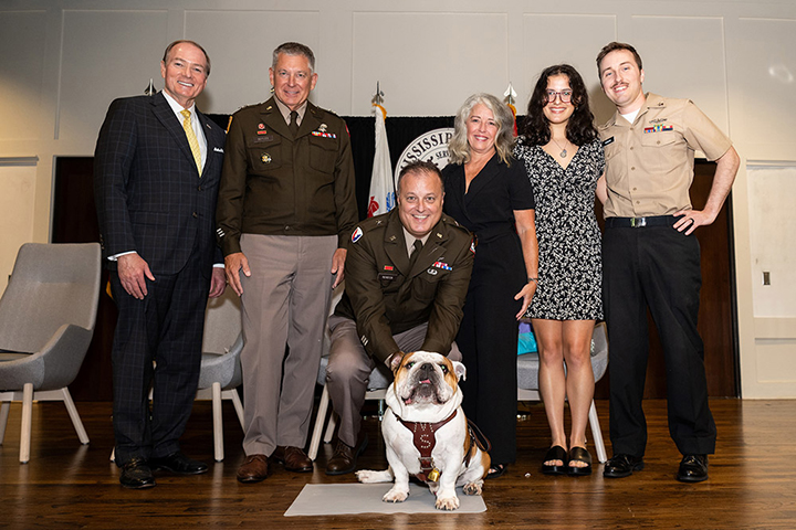 Andrew Rendon pets MSU's Bully mascot while celebrating his promotion