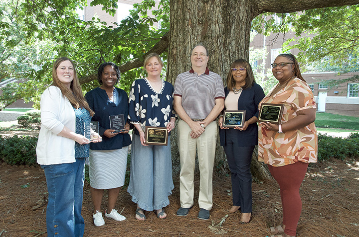 College of Arts and Sciences staff members with Dean Rick Travis