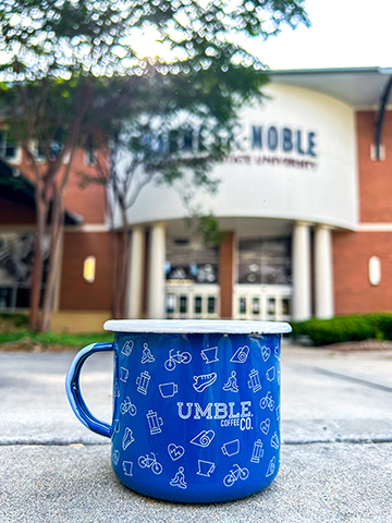 Umble Coffee mug in front of Barnes and Noble